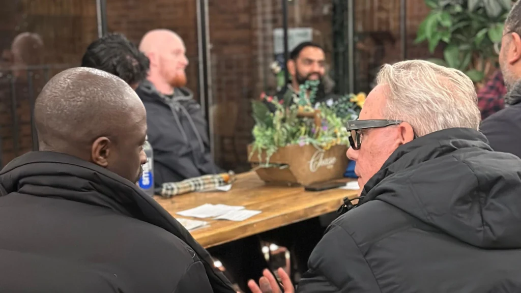 A-group-of-Mens-Prosperity-Club-(MPC)-members-engaged-in-a-discussion-about-strategies-to-overcome-financial-stress