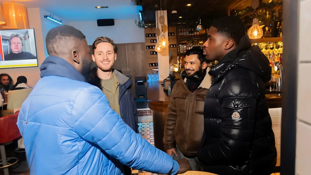 A-group-of-men-engages-in-conversation-at-a-social-gathering-symbolizing-the-networking-and-support-within-Mens-Prosperity-Club-events-which-often-focus-on-personal-and-professional-growth