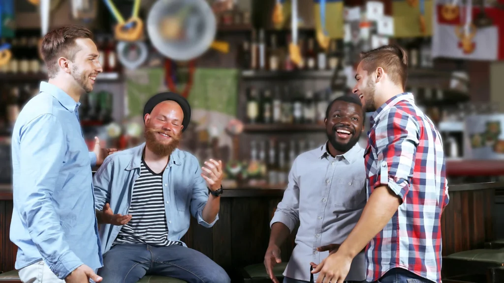 A-group-of-men-laughing-and-talking-in-a-relaxed-environment-highlight-the-importance-of-breaking-the-silent-struggle-through-social-connections