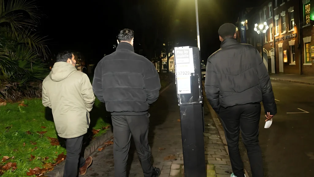 Three-members-of-the-Mens-Prosperity-Club-(MPC)-walking-together-in-the-evening-promoting-community-bonding-and-spiritual-growth-through-shared-experiences-and-support