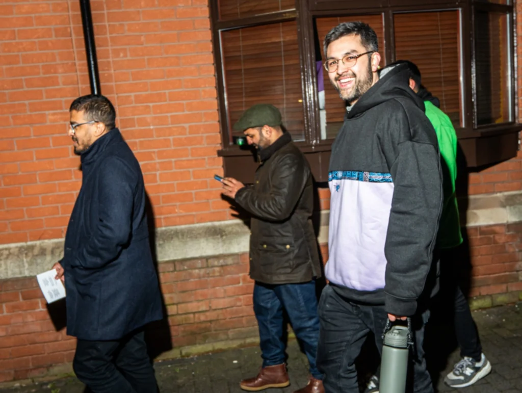 A-group-of-people-walking-together-outdoors-during-season-2-session-4-of-MPC