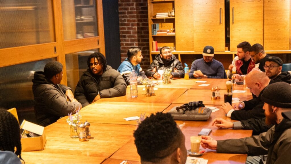 MPC-group-gathered-around-a-table-during-an-event-focused-on-health-fitness-and-brain-exercises