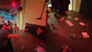 Guests-playing-poker-around-a-dark-table-in-a-casual-evening-setting-with-drinks-and-chips