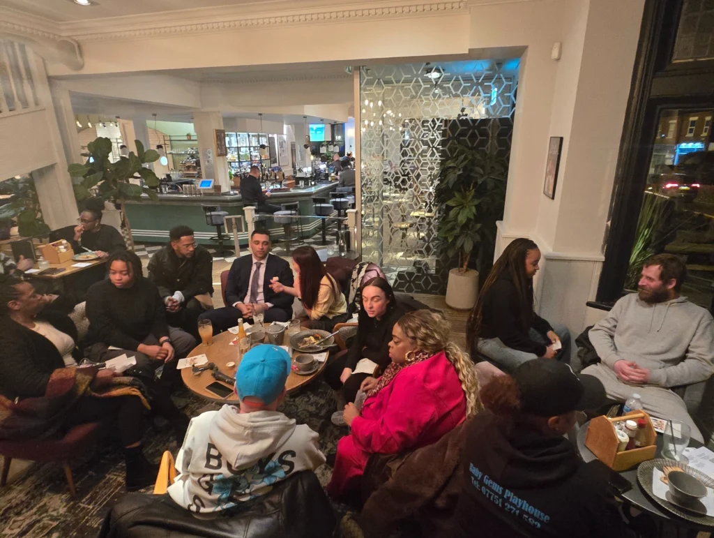 Group-of-people-engaged-in-conversation-at-a-coffee-morning-event