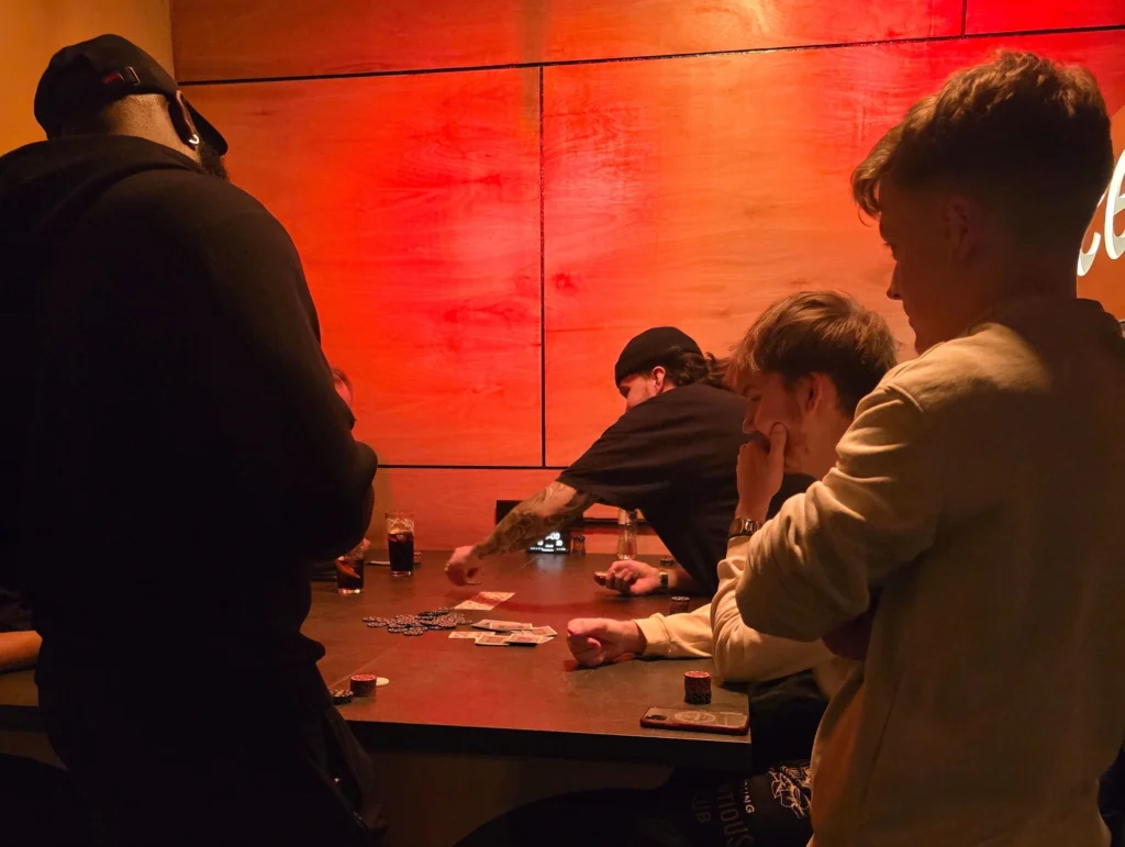 Group-playing-poker-with-cards-and-chips-at-MPC-Social-Games