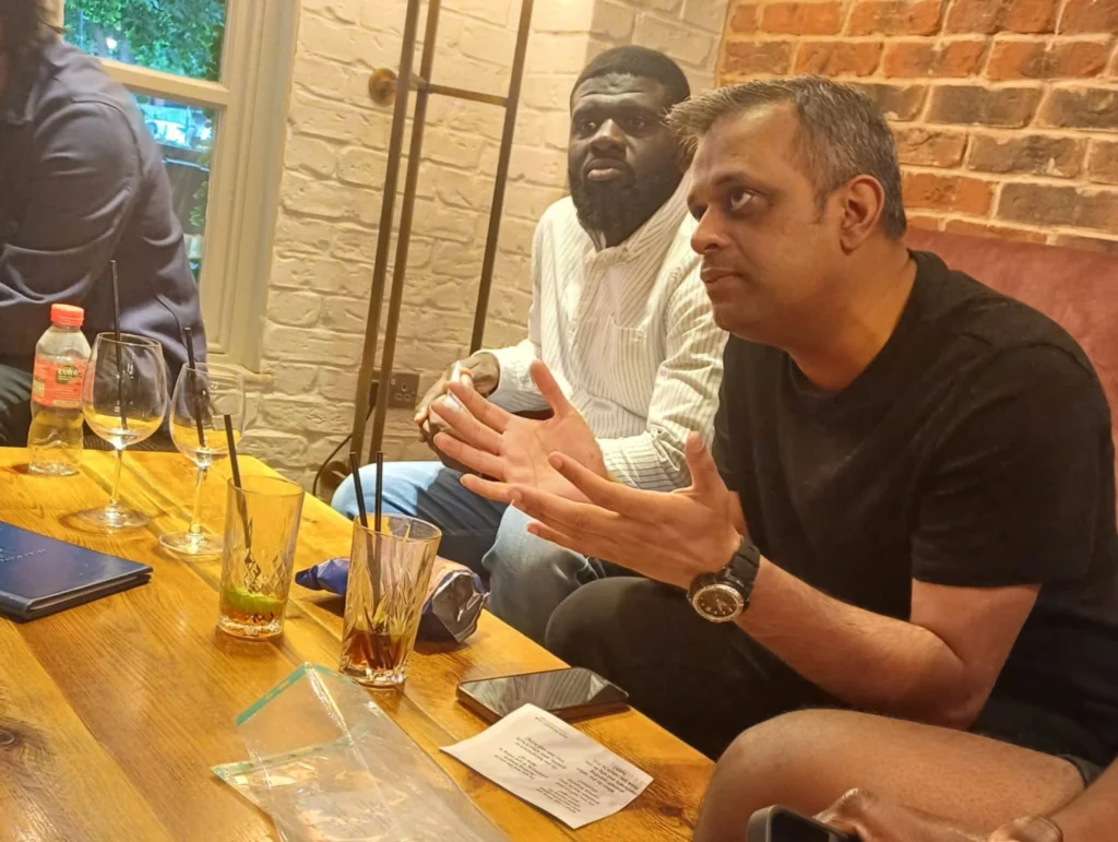 Close-up-of-two-participants-in-a-deep-conversation-at-the-Mens-Prosperity-Club-event