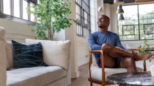 Man-enjoying-a-peaceful-moment-after-working-on-financial-planning.