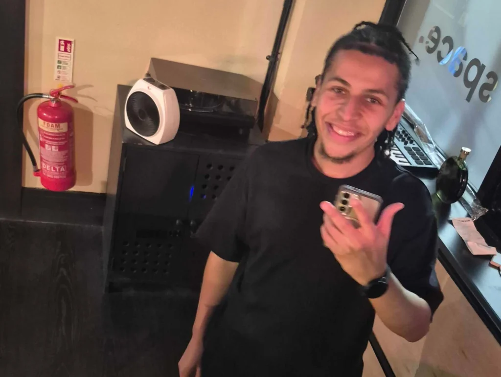 A-man-smiling-at-the-camera-during-a-social-event-Games-Social-October-2025