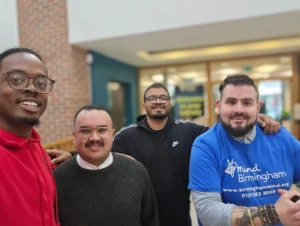 Newman-University-Event-Group-photo-at-the-Men's-Prosperity-Club-booth