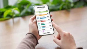 Person-holding-smartphone-showing-expense-tracking-app-Budget-Planner