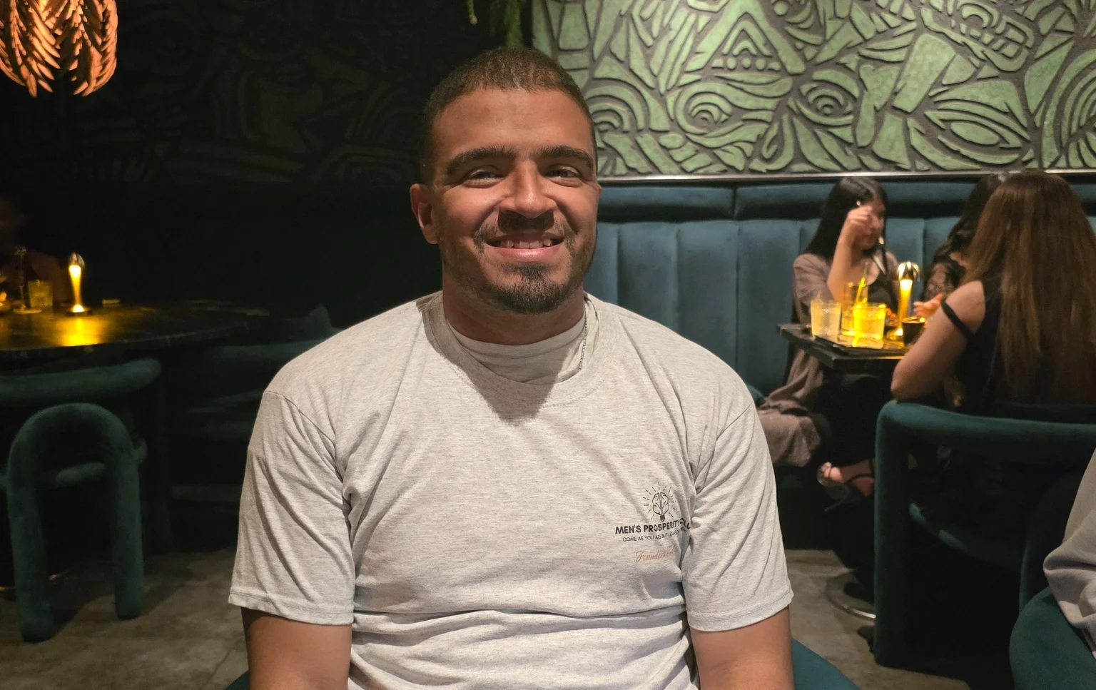 Attendee-smiling-at-the-End-of-Season-Dinner