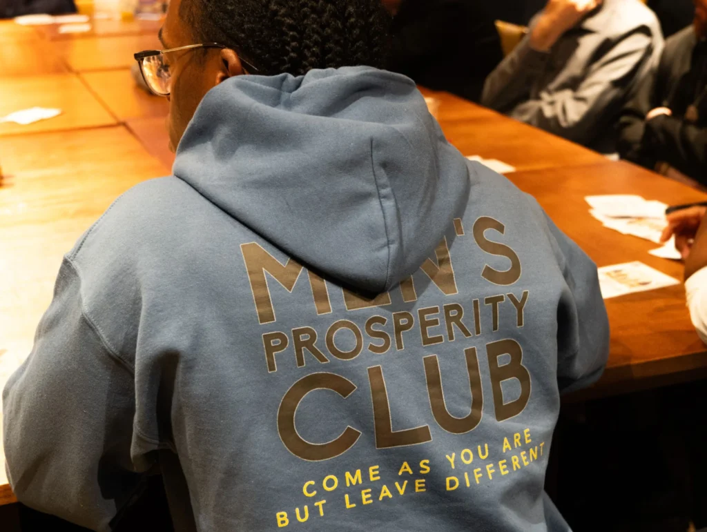 Close-up-of-person-in-blue-hoodie-at-health-and-fitness-meeting