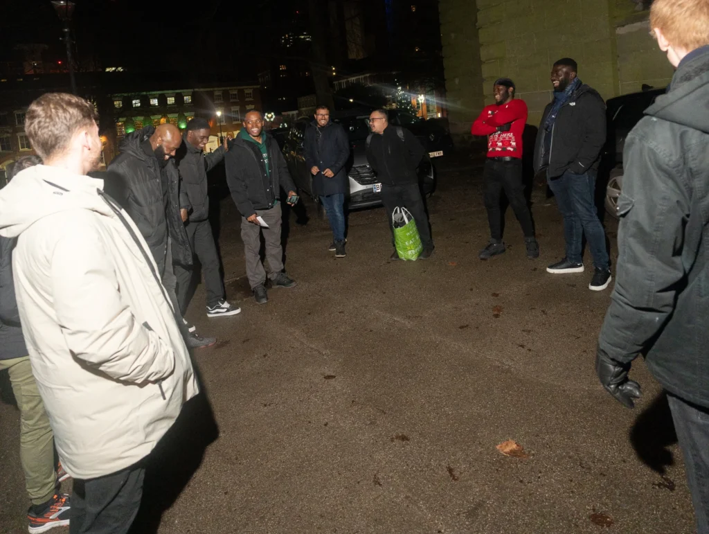 Group-gathered-outside-in-a-circle-discussing-faith-and-spirituality-topics