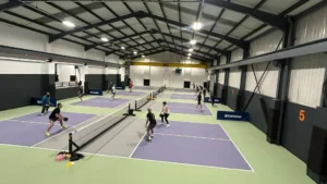 Indoor-pickleball-courts-in-Birmingham-filled-with-players-enjoying-a-friendly-match-and-competition